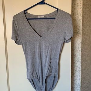 Lush grey bodysuit. Jersey like material. Super soft. Slimming. Size small